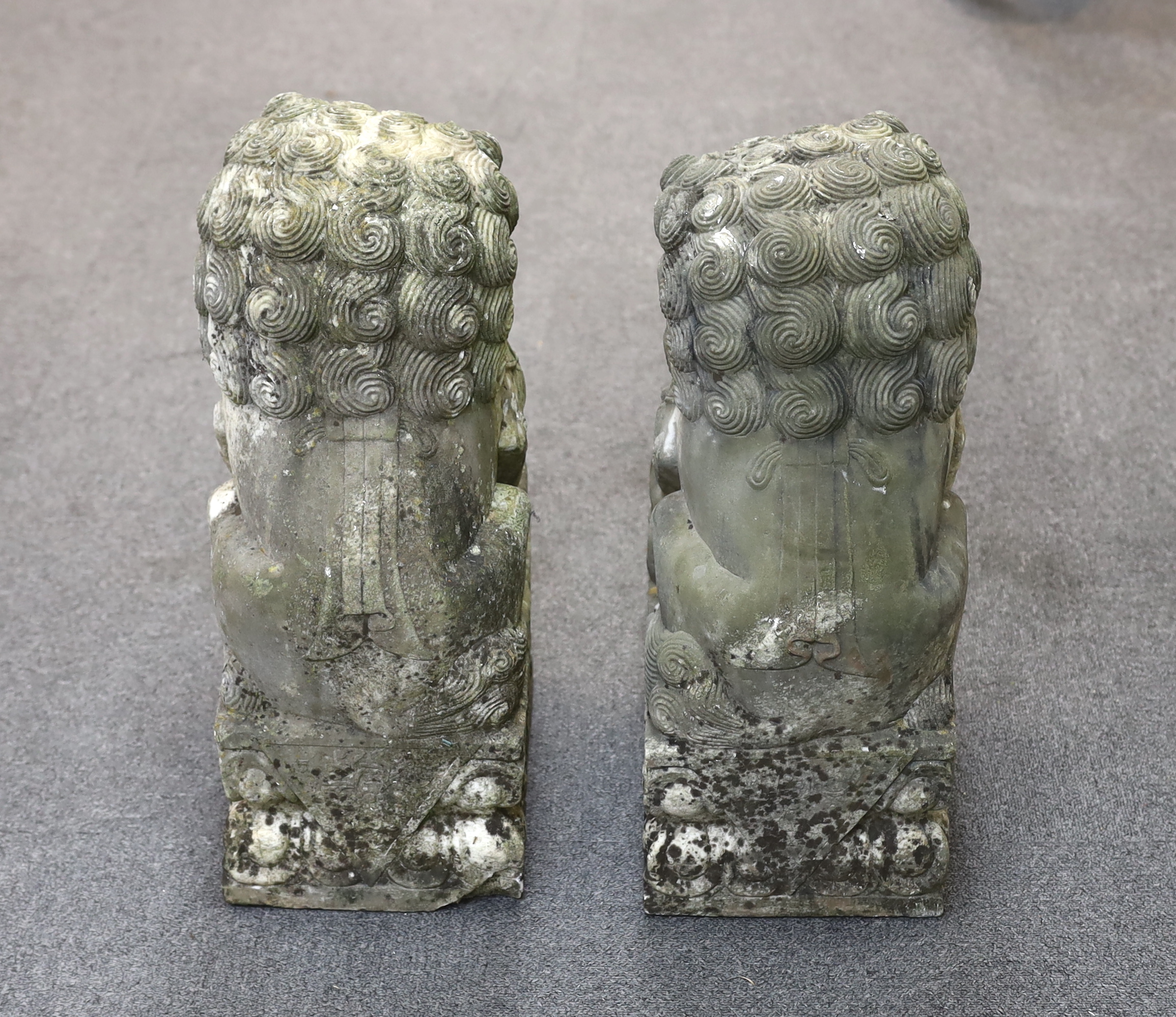 A pair of 20th century Chinese carved marble garden statues modelled as Dogs of Fo, 22cm wide, 31cm deep, 54cm high